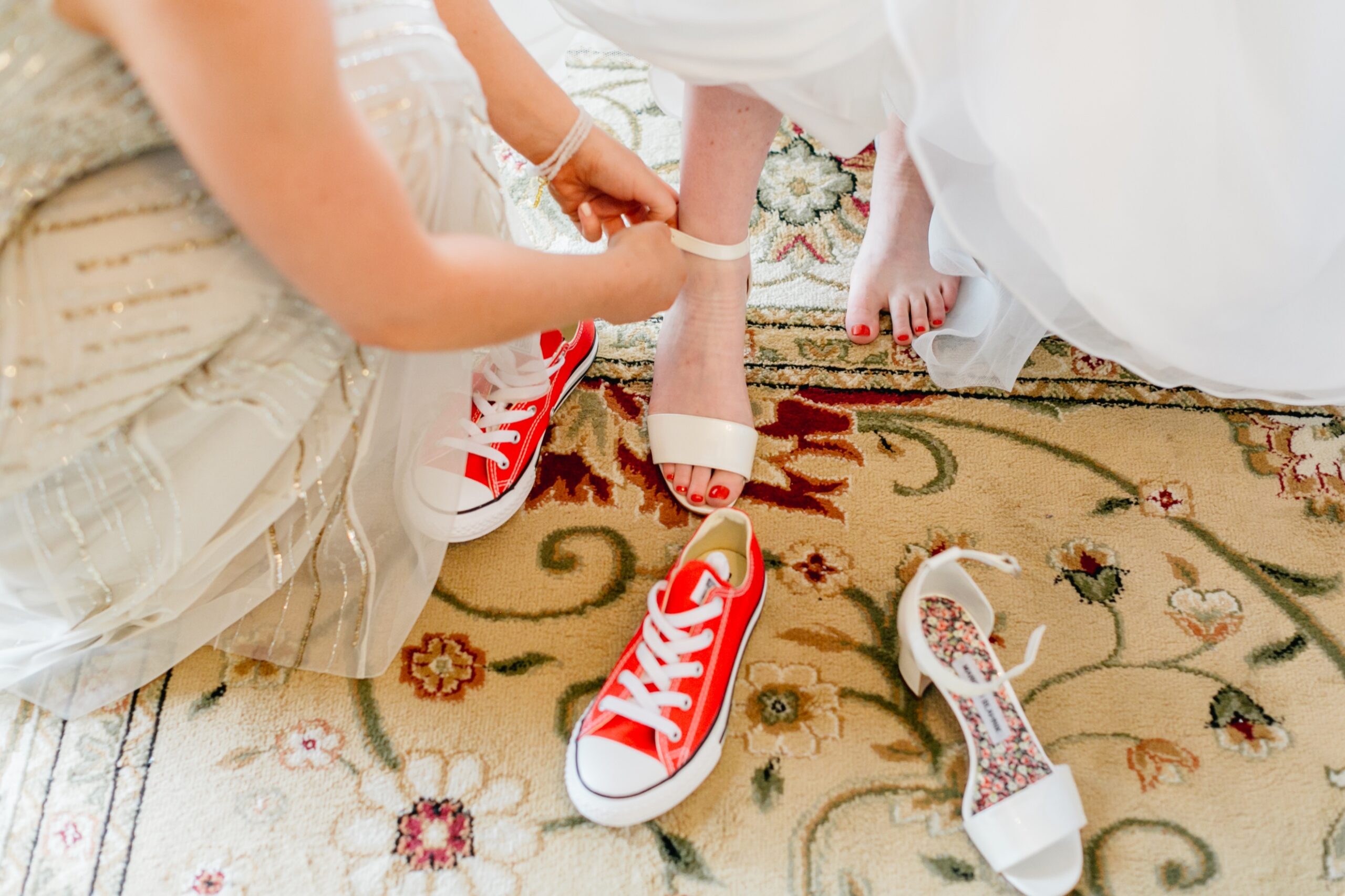 Bride wearing red converse for her wedding day
