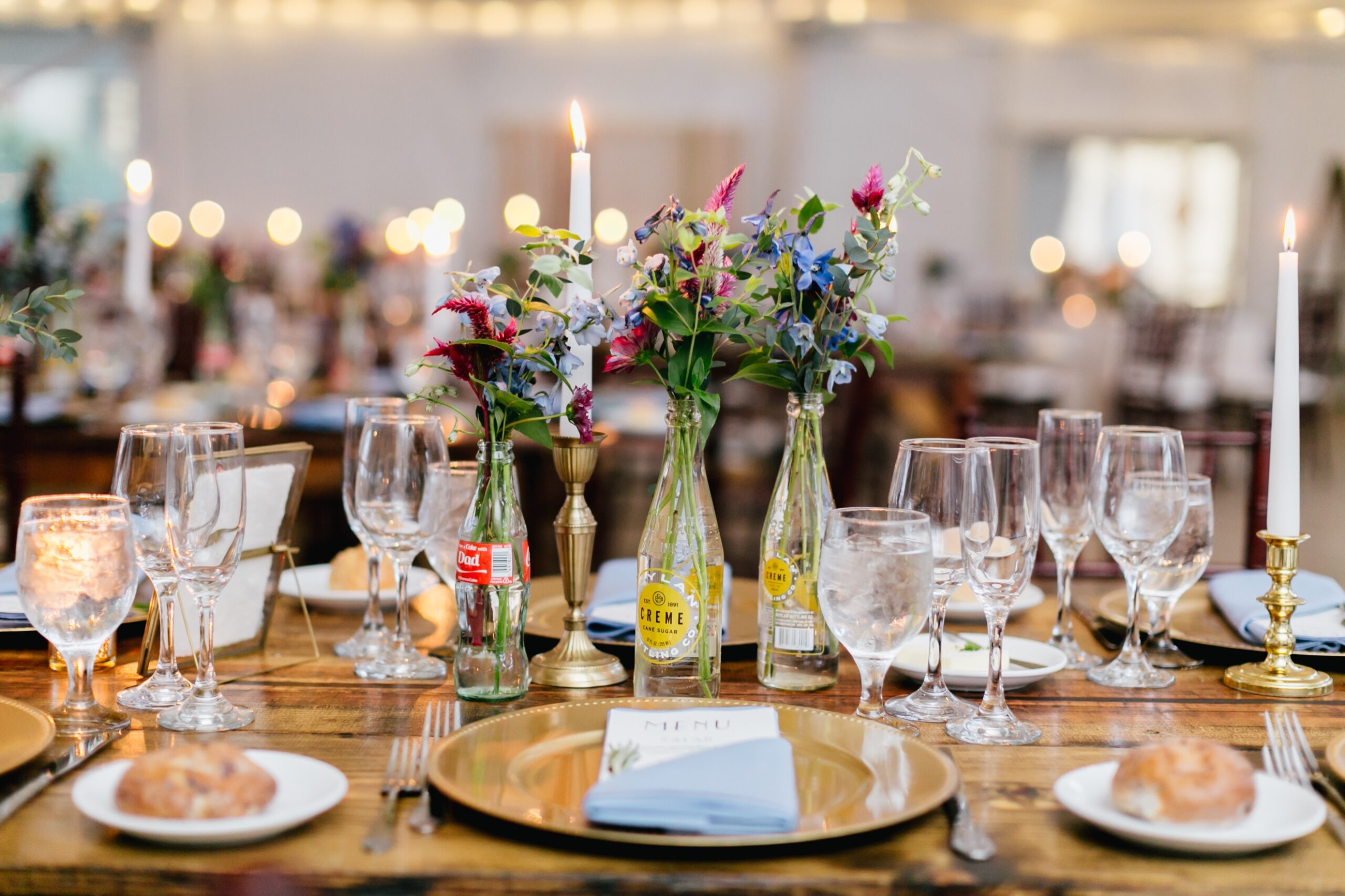 Colorful floral centerpieces at a tented reception at Glen Foerd
