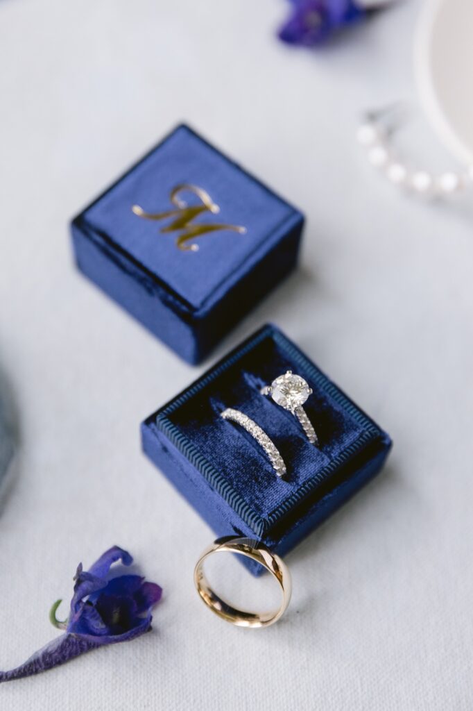 Weddings rings in a monogrammed deep blue velvet box