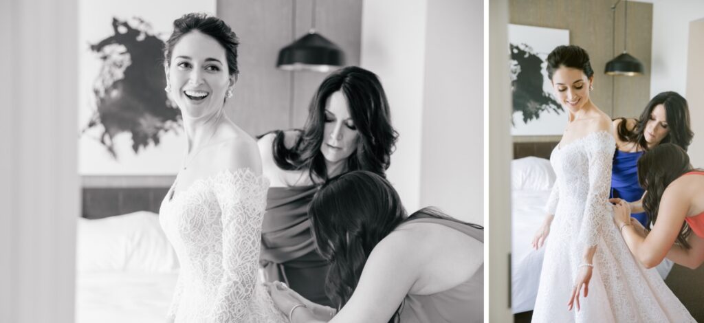 Bride getting help putting on her lace wedding gown