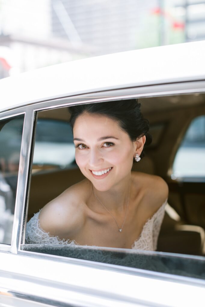 Elegant bride in a vintage Rolls Royce by Emily Wren Photography