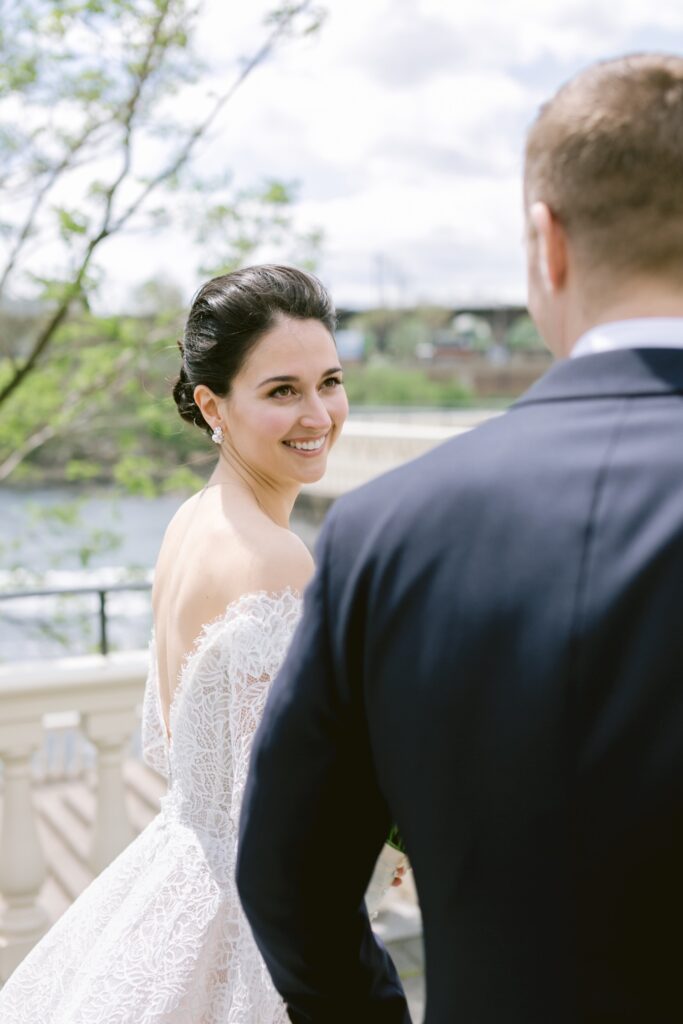 Bride smiling at looking at her groom at an elegant spring wedding in Pennsylvania