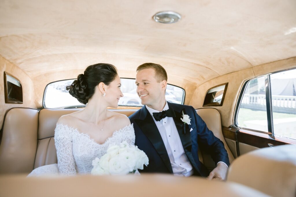 Bride and groom in a classic Rolls Royce at a luxury wedding in Philadelphia