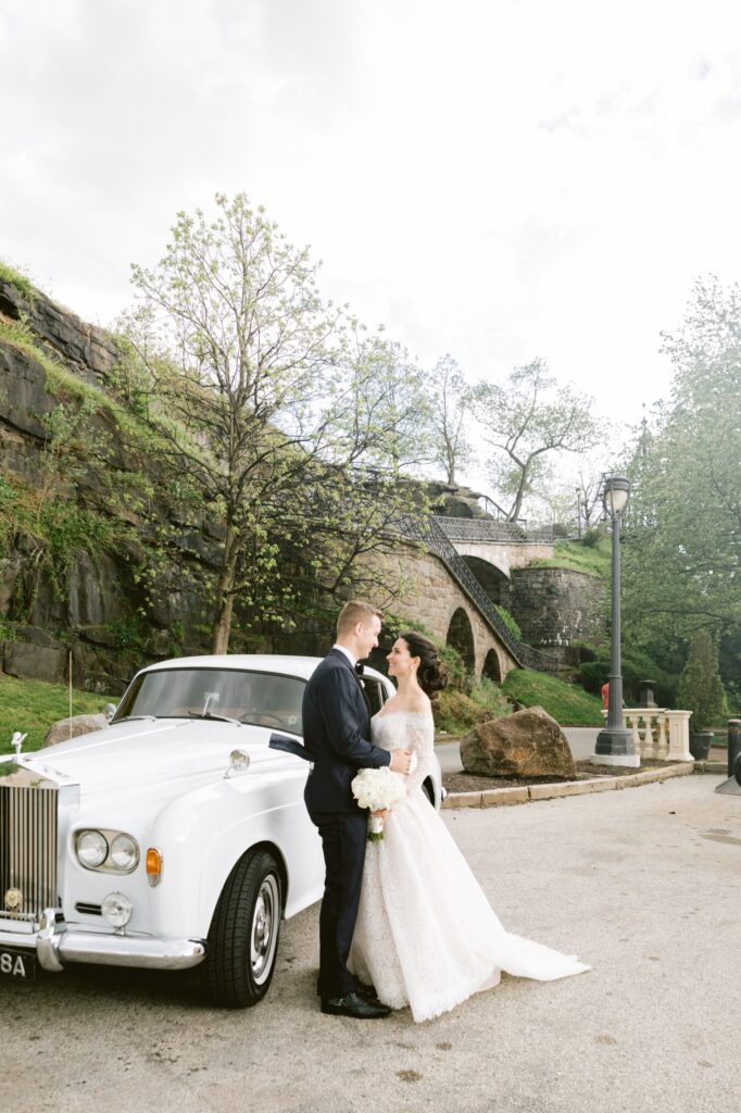 Newlyweds with a vintage car on a spring wedding day in Philadelphia