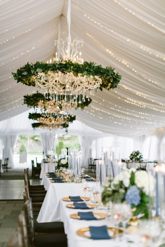 Tented reception with twinkle lights and blue details