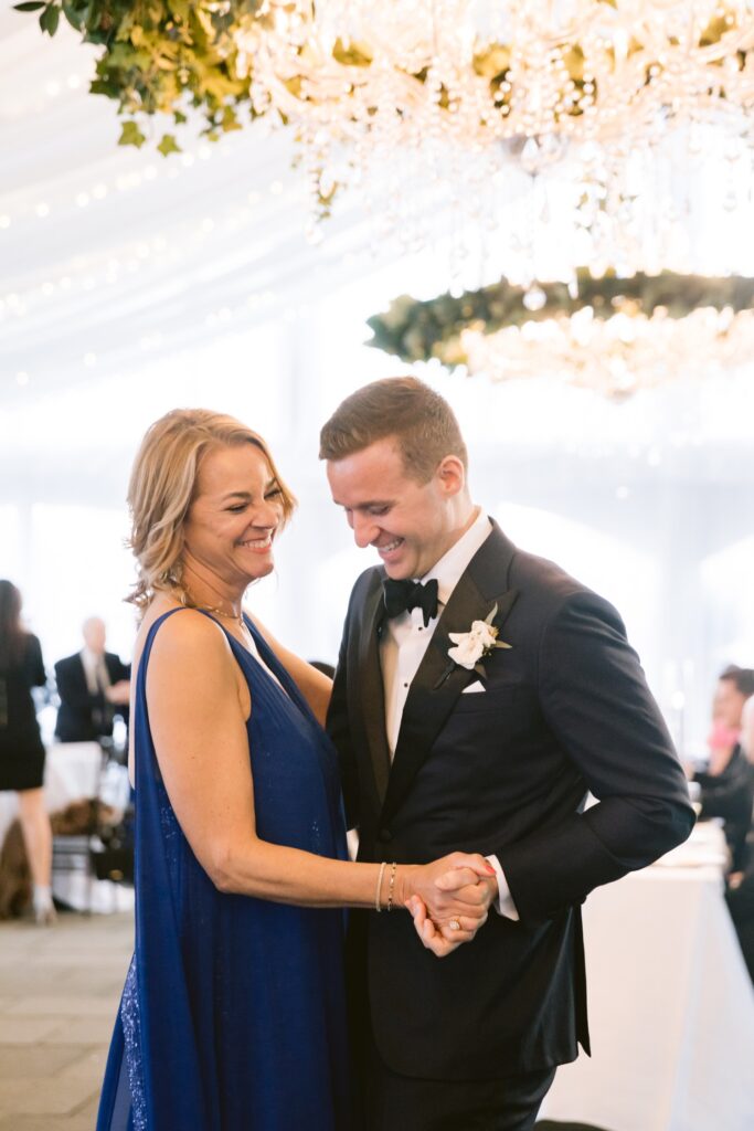 Groom dancing with his mother at a luxury tented wedding reception in Philadelphia