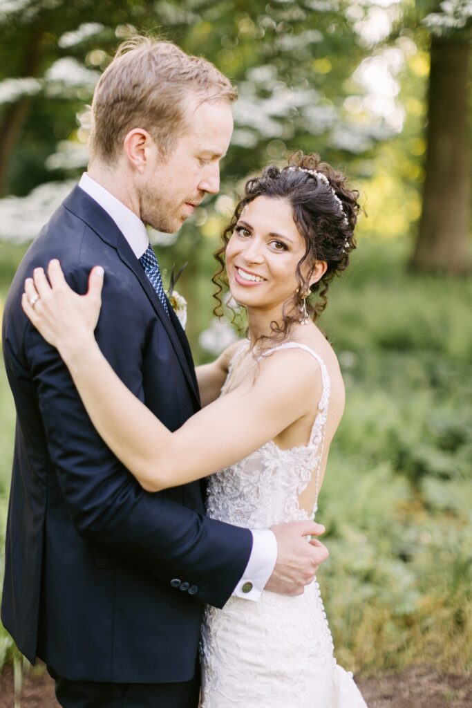 Newlyweds smiling on an enchanted spring day by Emily Wren Photography in Philadelphia