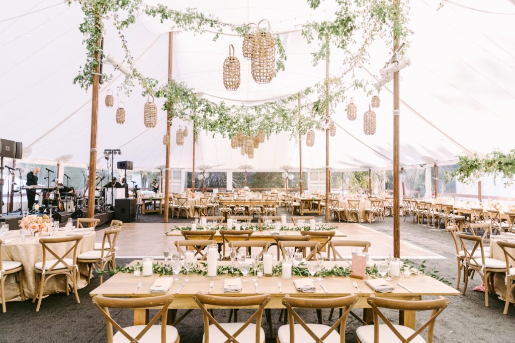 Tented backyard wedding reception decor on a bright spring day on the Main Line