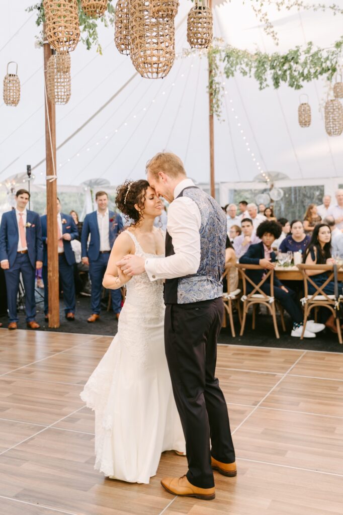 Bride and groom during their first dance at a luxury backyard wedding on a spring day in Pennsylvania