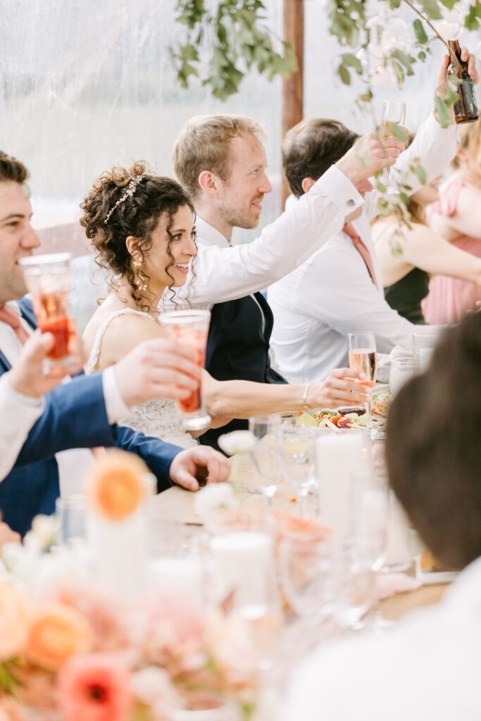 Newlyweds toast speeches at an enchanting spring wedding reception on the Main Line