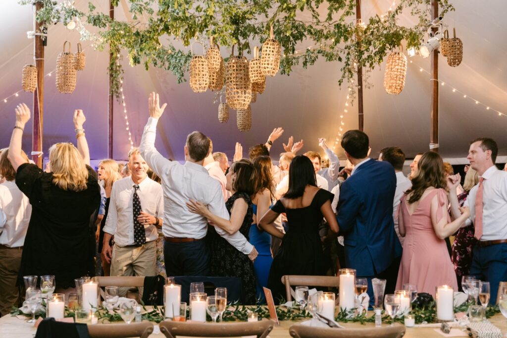 Wedding guests partying at an energetic outdoor spring wedding reception in Philadelphia