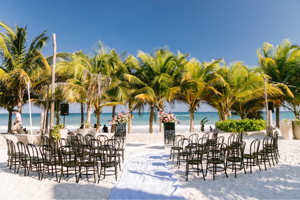 Luxury wedding ceremony on the beach at a destination wedding in Tulum, Mexico