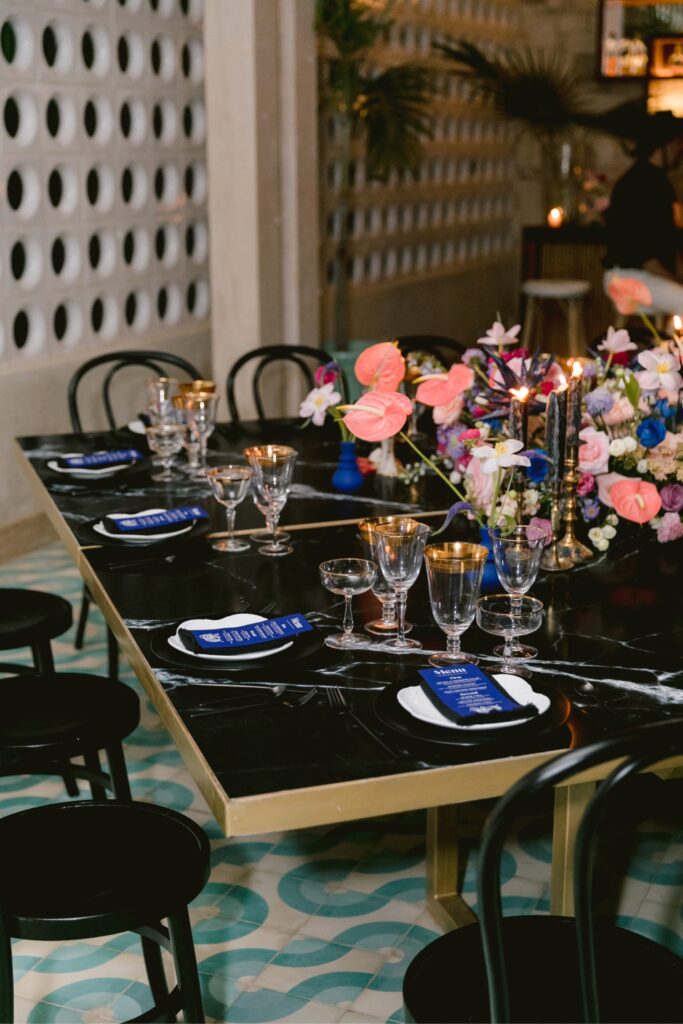 Monochromatic black table at a modern wedding reception