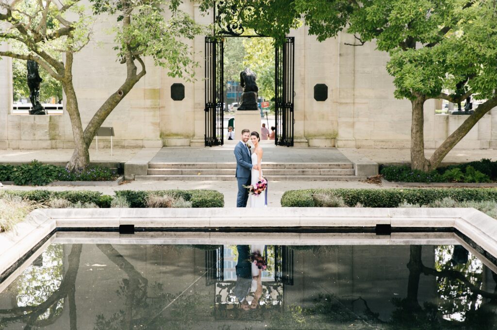 Bride and groom smiling at the Rodin Museum in Philadelphia
