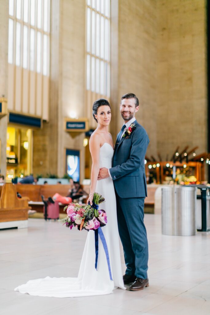 Bride and groom on their wedding day at 30th Street Station in Philadelphia