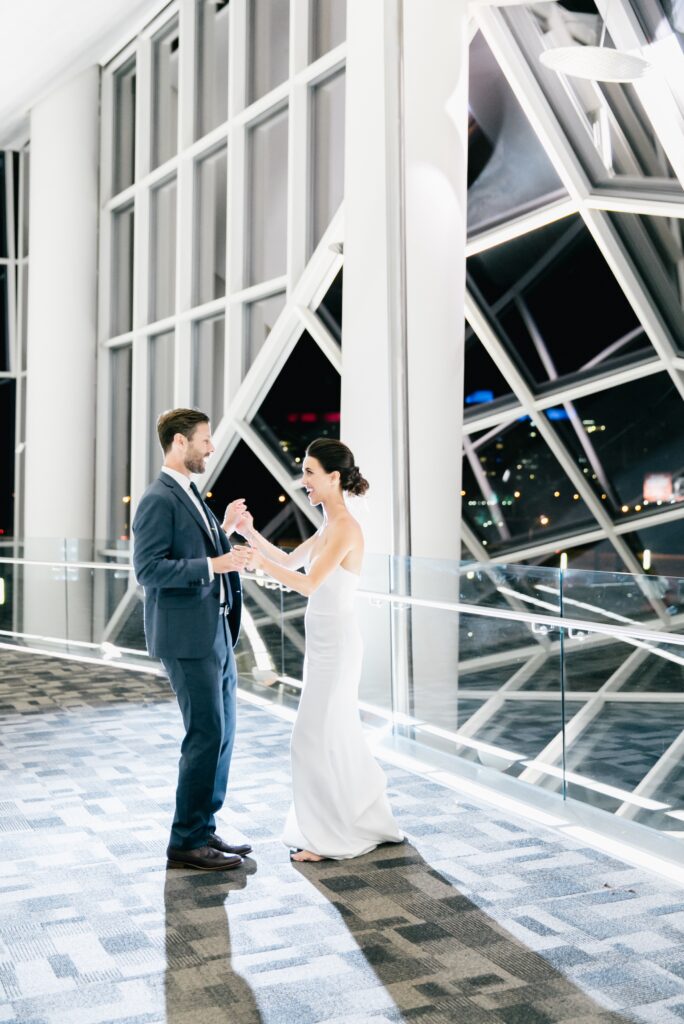 Bride and groom dancing at an urban wedding reception by Emily Wren Photography