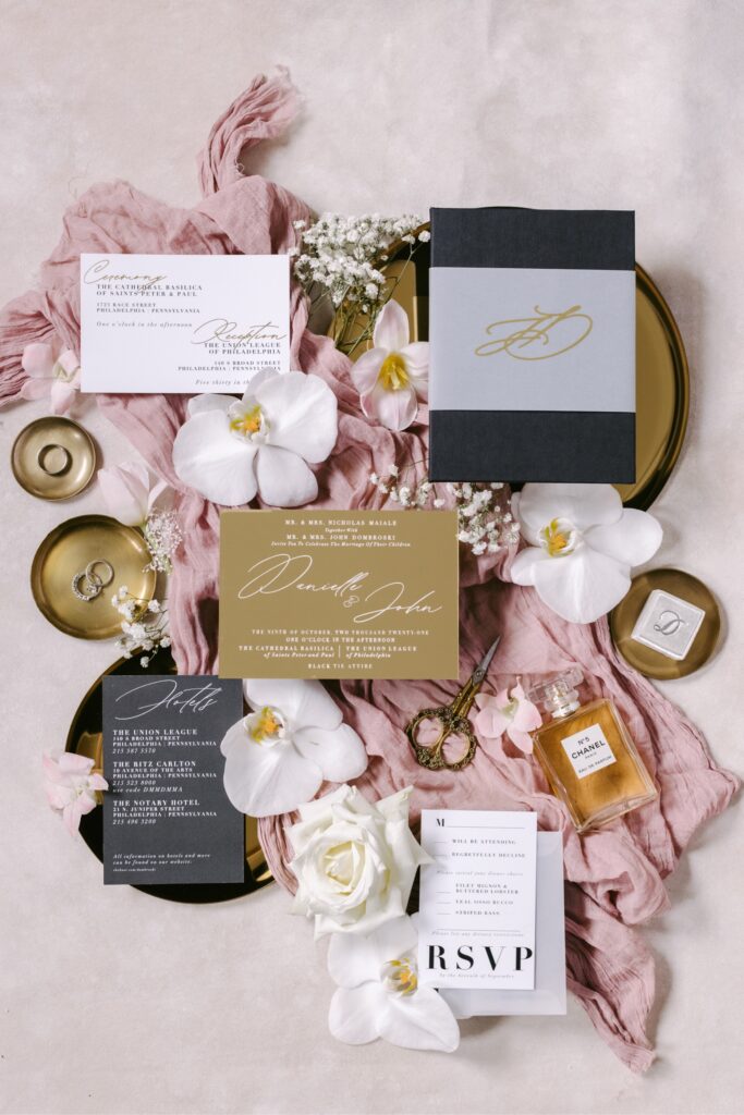 Luxury custom wedding invitation suite with black and gold details