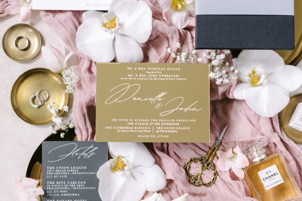 Gold wedding invitation with black details
