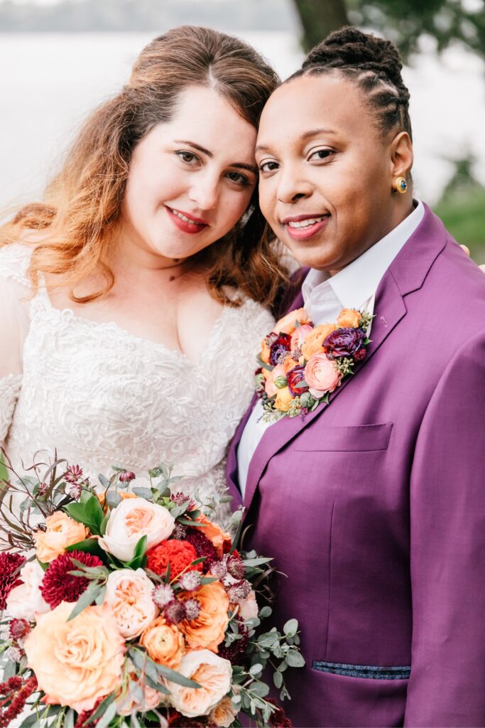 Brides smiling during their wedding day couple's portraits by Emily Wren Photography