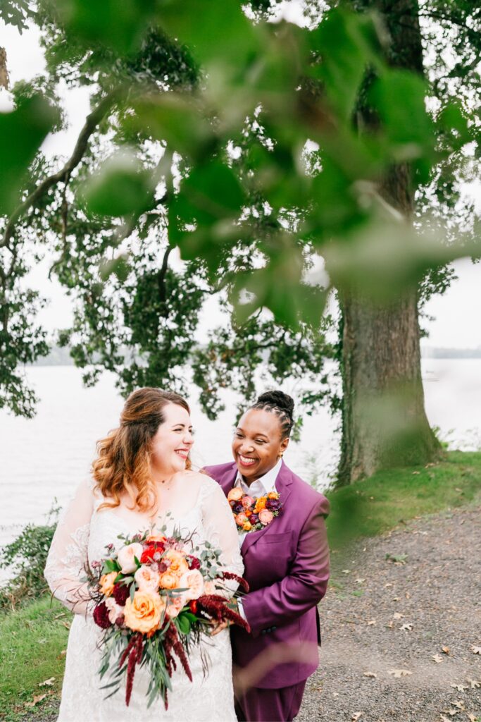 LGBTQ couple laughing on their playful wedding day in Philadelphia