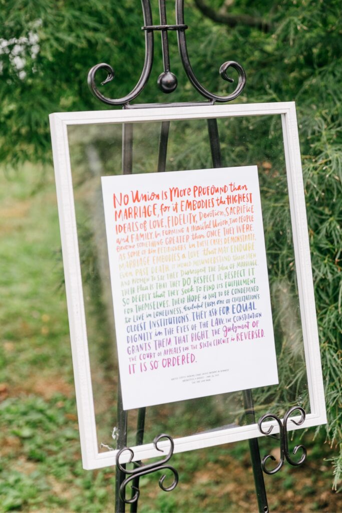 Rainbow ceremony sign for a playful LGBTQ wedding in Philadelphia
