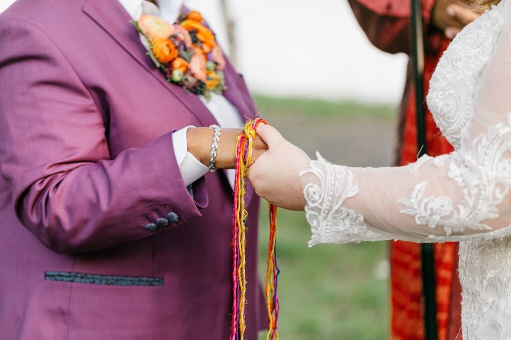Handfasting at an interracial lesbian wedding by Emily Wren Photography