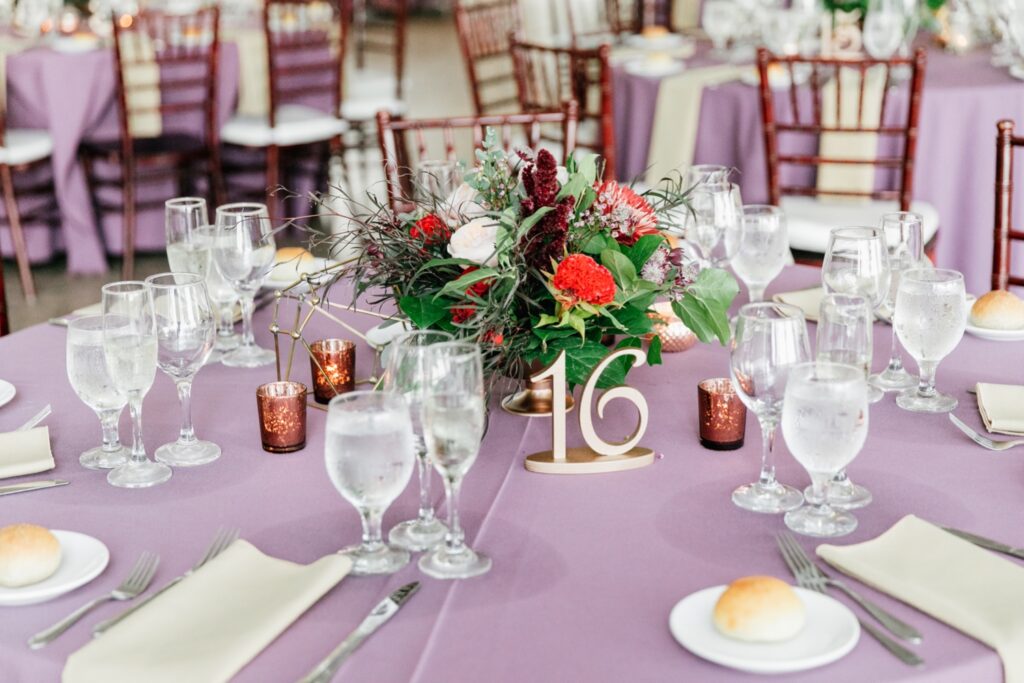 Table decor for a purple LGBTQ interracial wedding reception in Pennsylvania