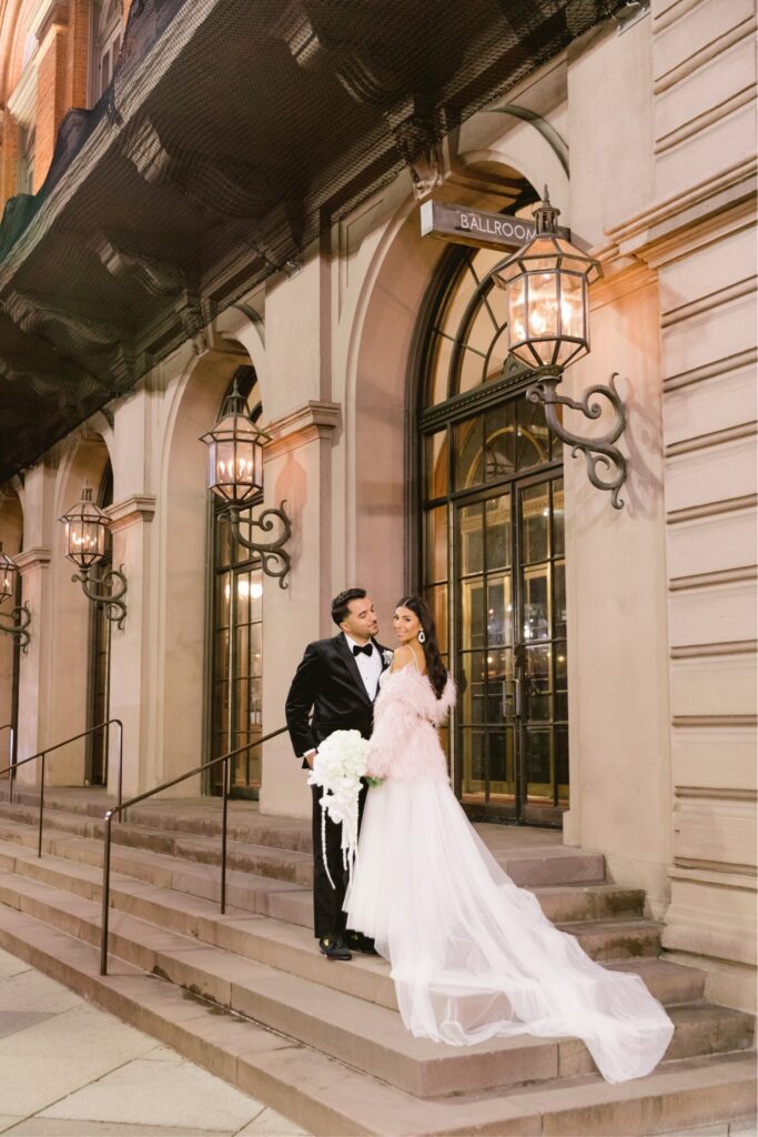 Bride and groom outside the Academy of Music in Philadelphia
