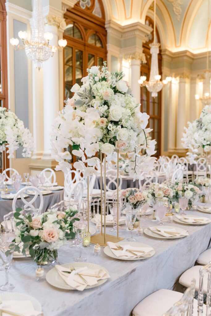 Flower table centerpieces in whites and blush at a luxury New Year's Eve wedding