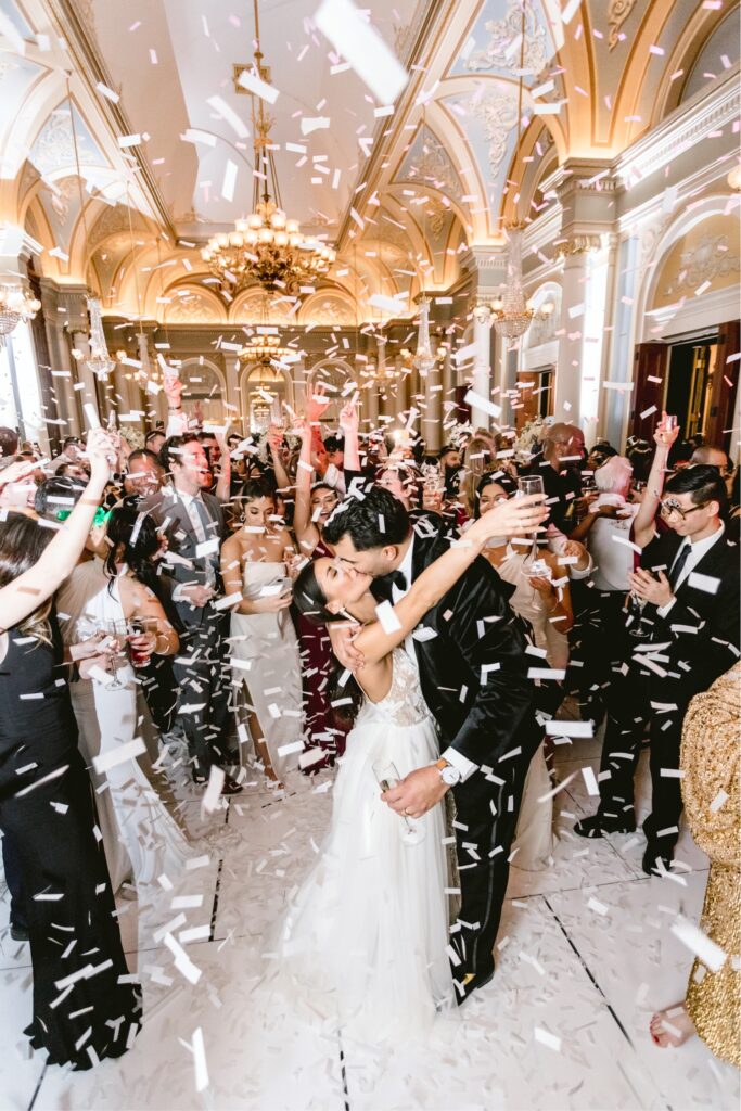 Bride and groom kissing at midnight at their stylish New Year's Eve wedding in Philadelphia