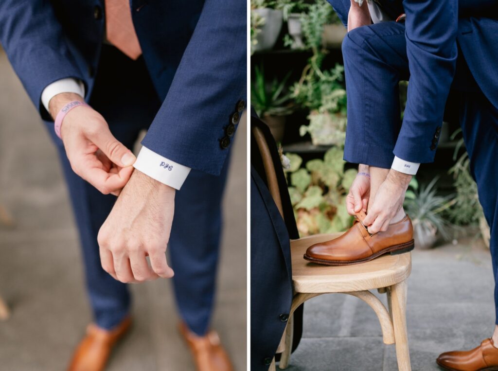 Monogramed details on a groom's blue suit before a magical wedding day