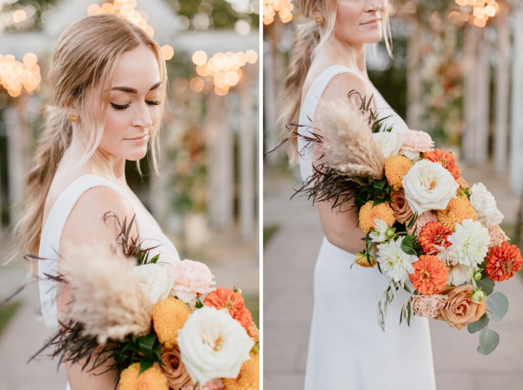 Bride holding her colorful wedding bouquet with orange hues