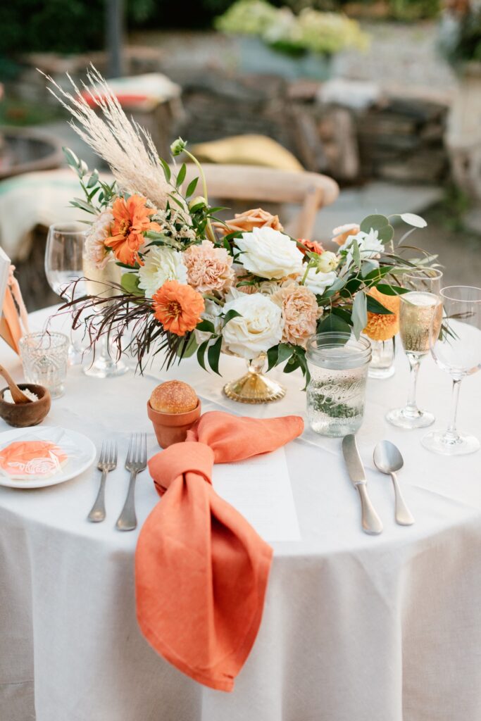 Bold table centerpiece with orange accents at a intimate garden wedding in Pennsylvania