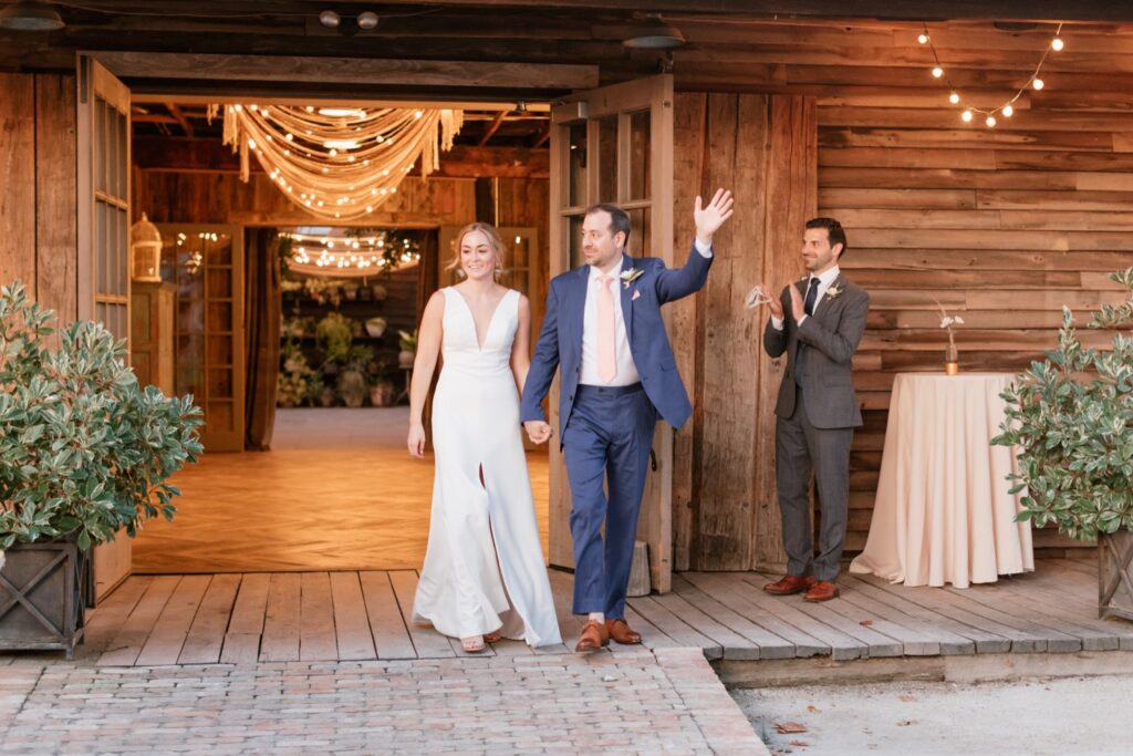 Newlyweds enter their small summer wedding reception at Terrain in Philadelphia