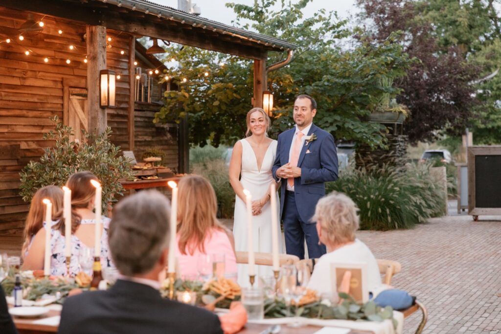 Newlyweds give a speech at their micro wedding reception in Pennsylvania