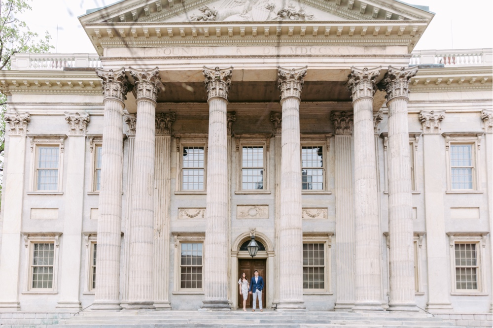 Engaged couple in front of Philadelphia's First National Bank by Emily Wren Photography