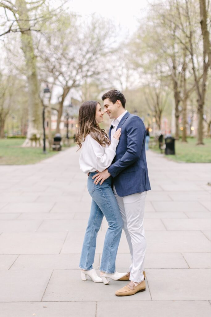 Engaged couple smiling during a spring photo session in Old City
