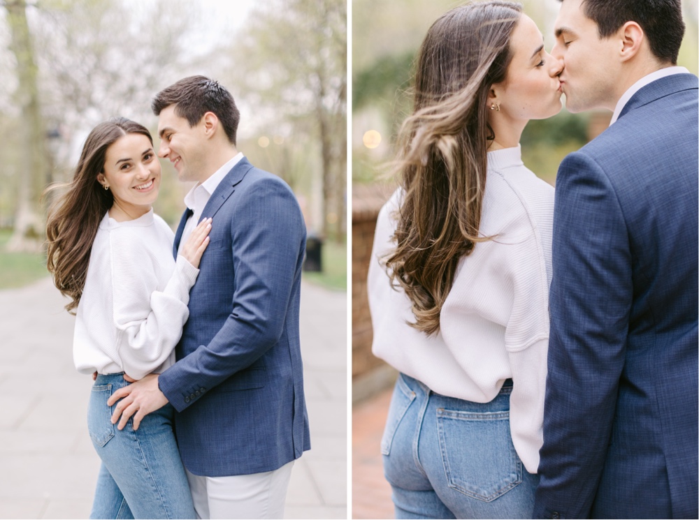 Engaged couple kissing during a cherry blossom filled spring portrait session