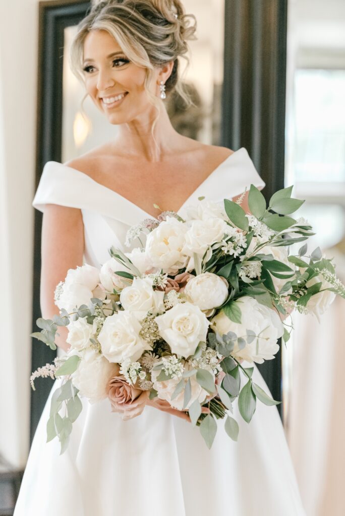 Bride holding a lush wedding bouquet