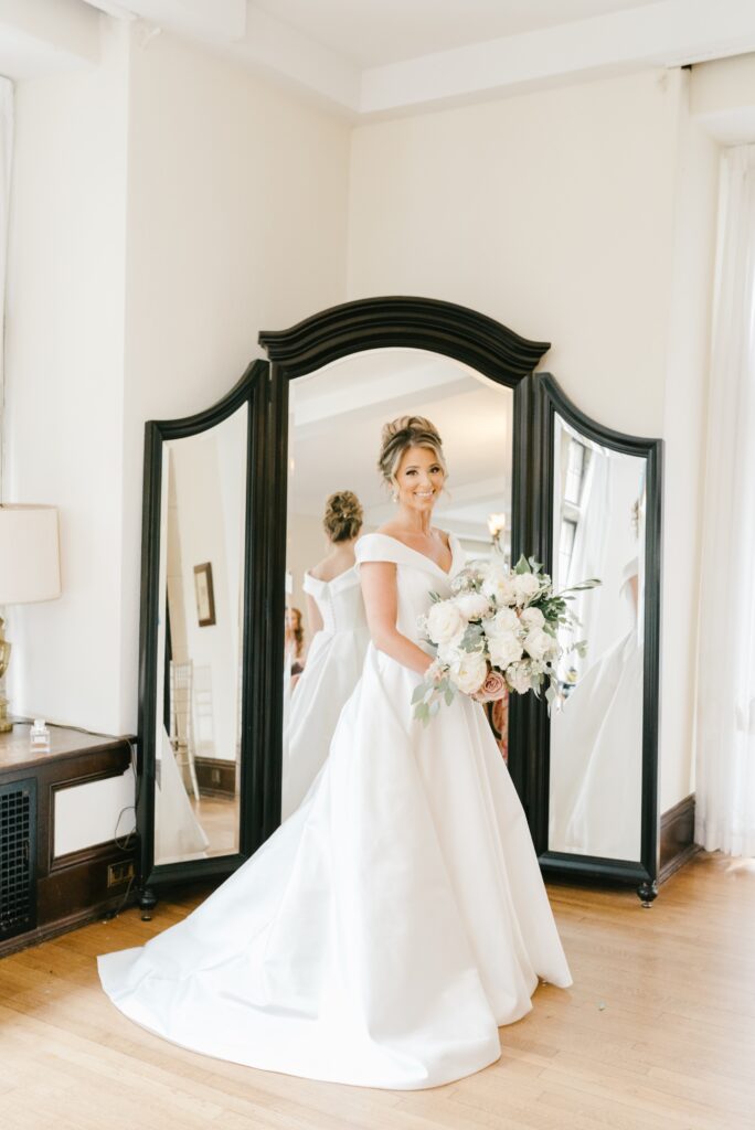 Bride in her wedding gown on the morning of a whimsical spring wedding