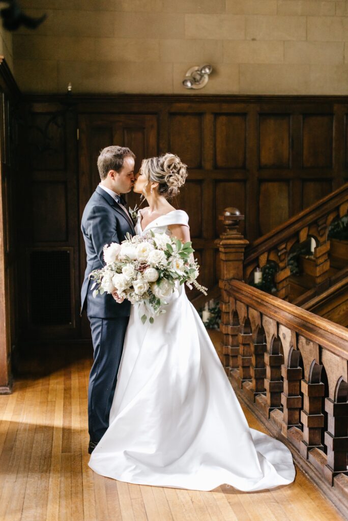 Bride and groom kissing at a historic mansion in Pennsylvania