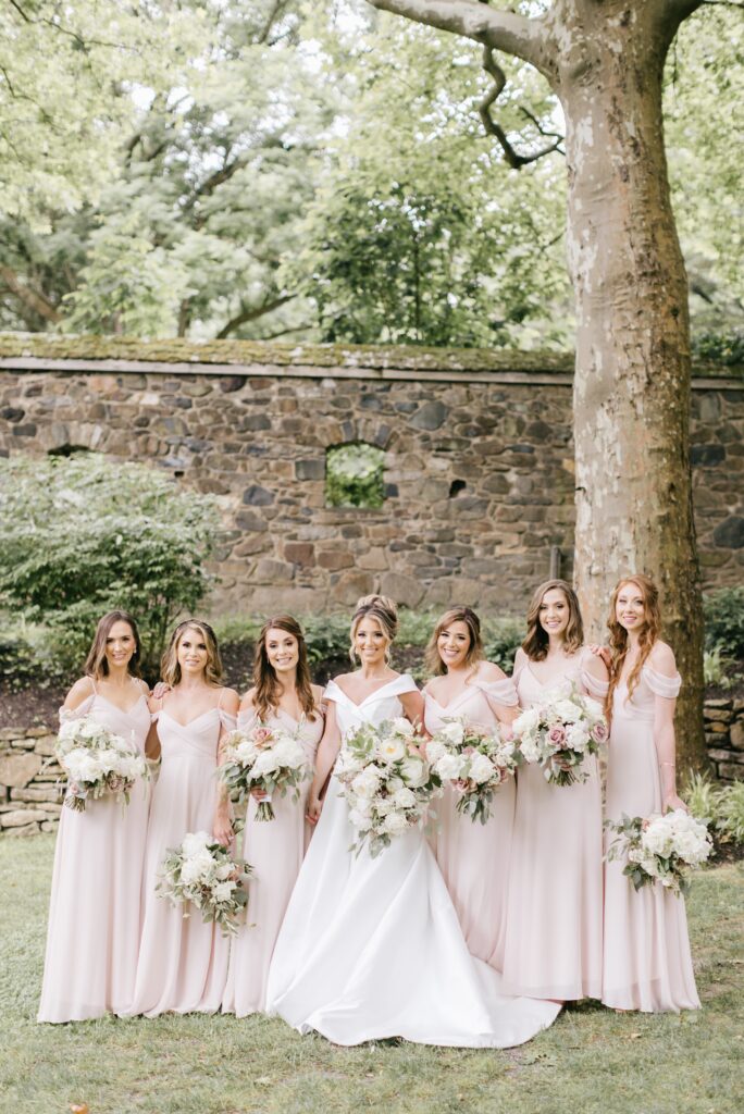 Bride and bridesmaids on the lawn at Parque Mansion in Philadelphia