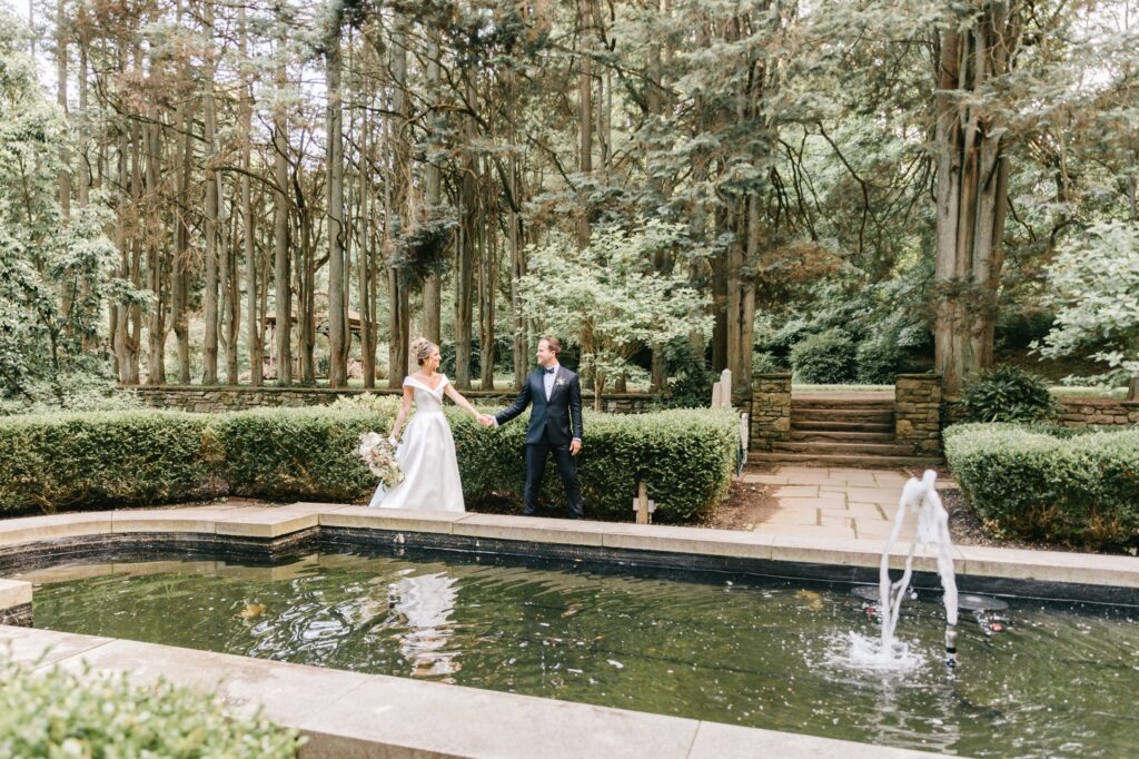 Bride and groom in a classic garden on a whimsical spring wedding day
