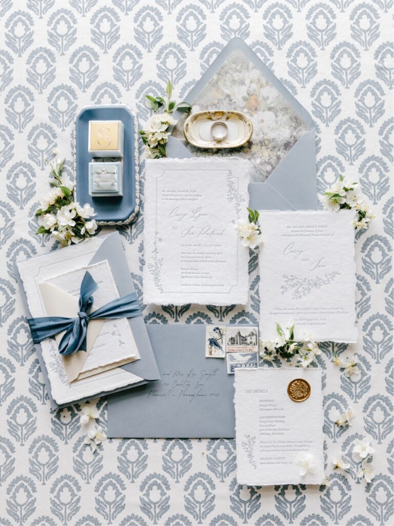 Blue and white wedding invitation suite designed by Papertree Studio for a winery wedding