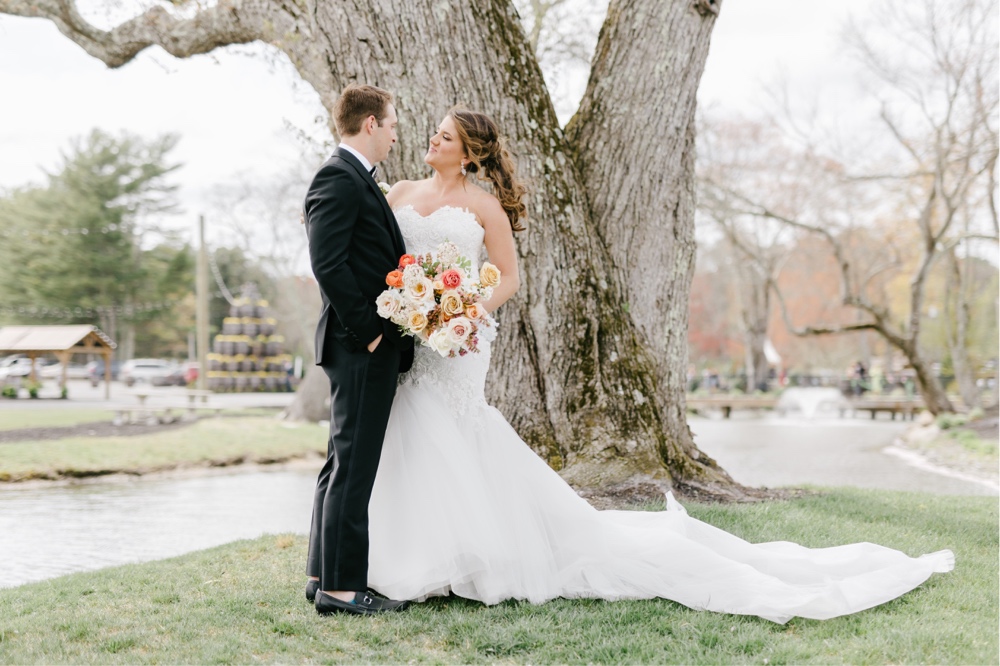 Bride and groom smiling on their enchanting spring wedding day at Renault Winery in New Jersey