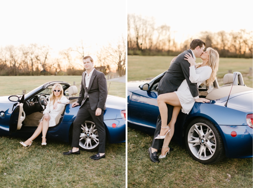 Engaged couple kissing against a BMW convertible during a golden hour engagement photo session with vintage inspiration