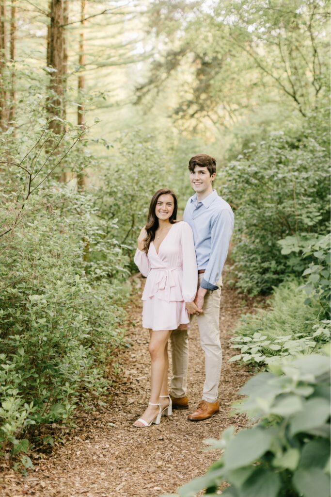 Couple surrounded by trees during a spring engagement shoot near Philadelphia