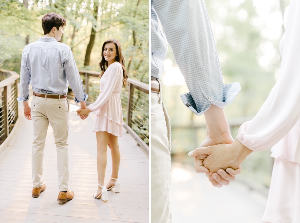 Couple holding hands on a tree lined path at Longwood Gardens in Pennsylvania