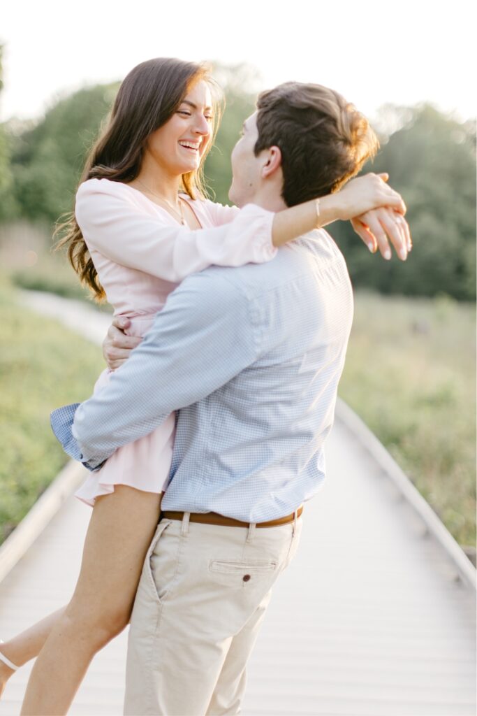 Couple laughing during a timeless spring engagement session in Philadelphia