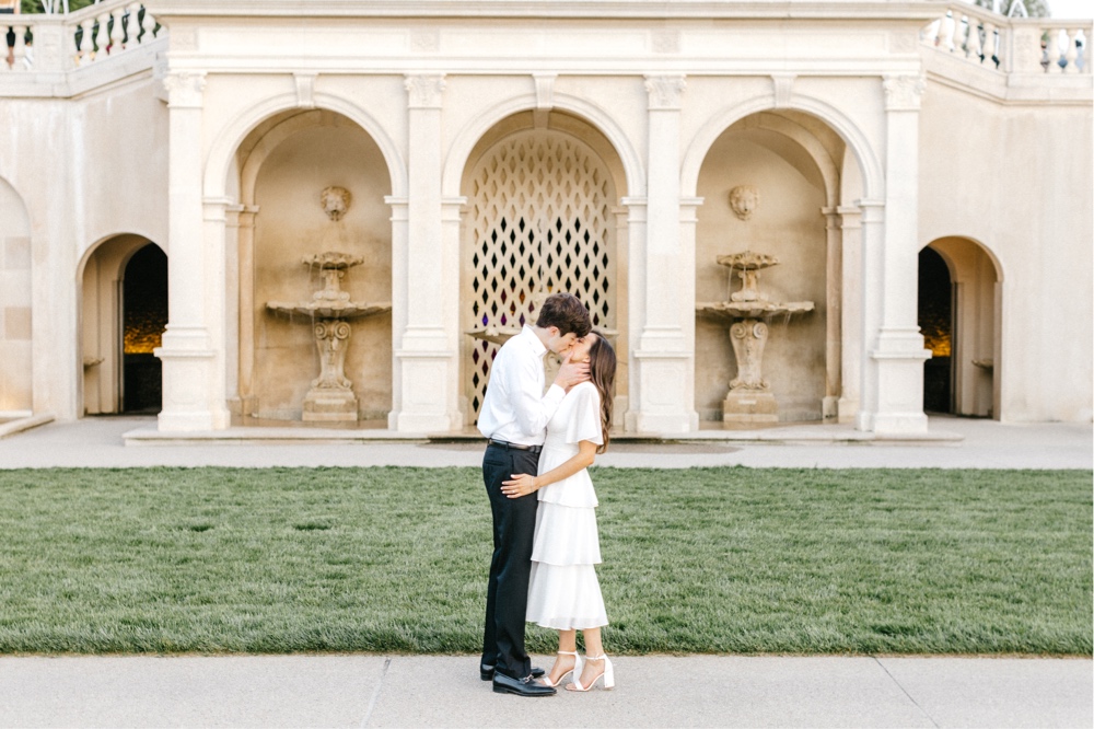 Couple kissing during sunset at an engagement session at Longwood Gardens by Emily Wren Photography